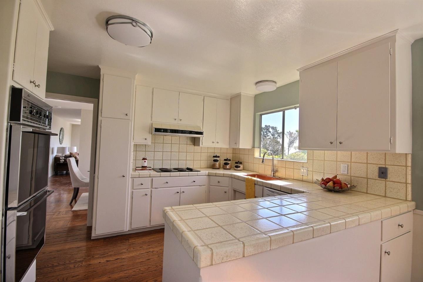 1817 Hunt Drive Burlingame, CA 94010 - Photo 8 of 20 a kitchen with a sink stove and refrigerator