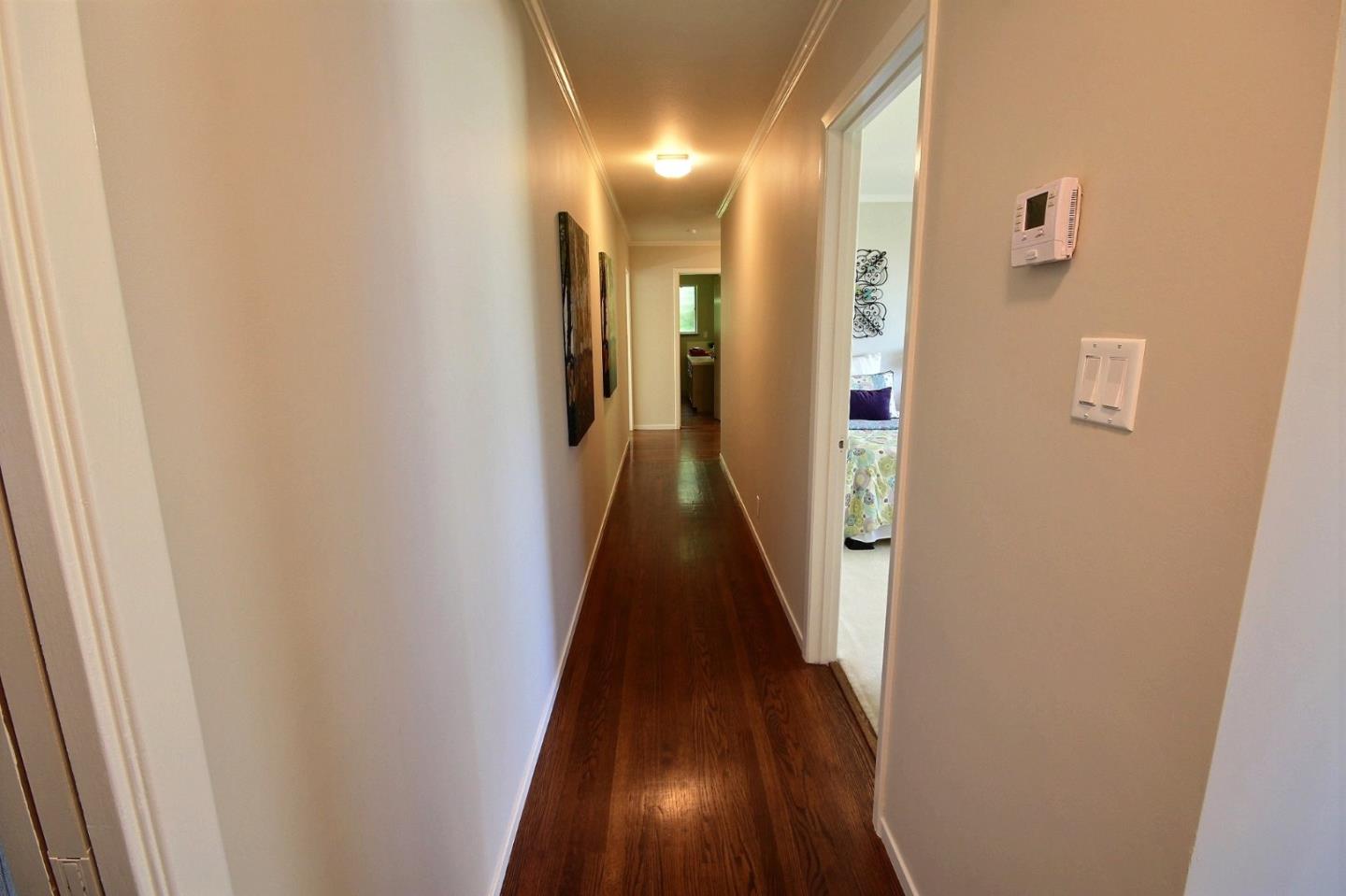 1817 Hunt Drive Burlingame, CA 94010 - Photo 10 of 20 a view of a hallway with a wooden floor