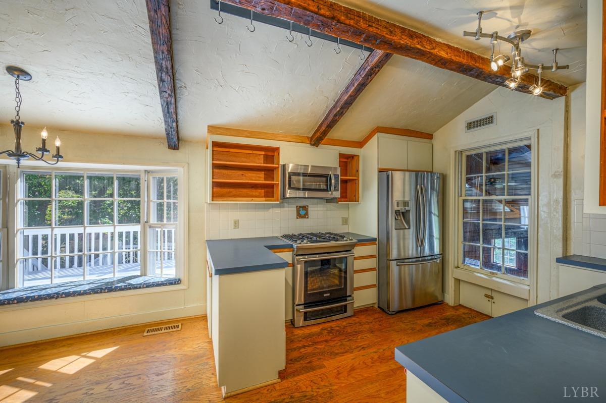 2812 Link Road Lynchburg, VA 24503 - Photo 13 of 65 a kitchen with stainless steel appliances granite countertop a stove and a refrigerator