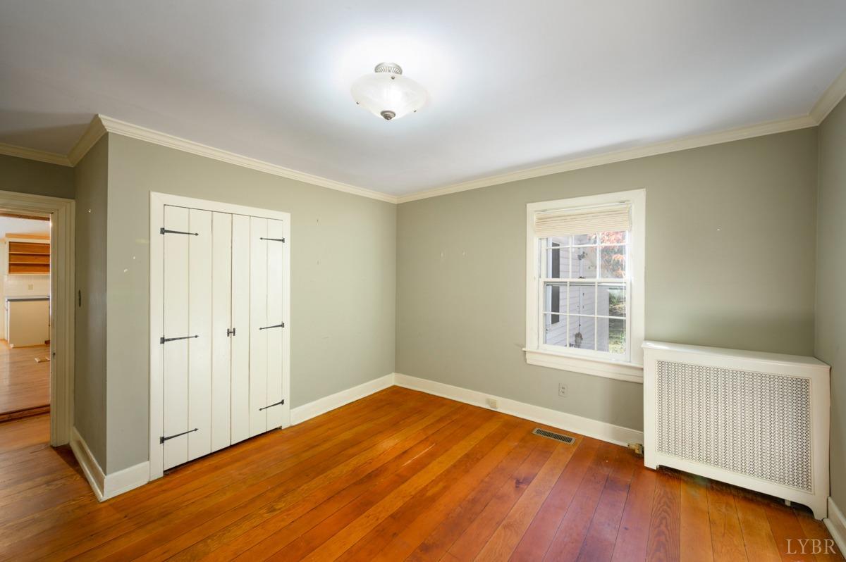 2812 Link Road Lynchburg, VA 24503 - Photo 19 of 65 an empty room with wooden floor and windows