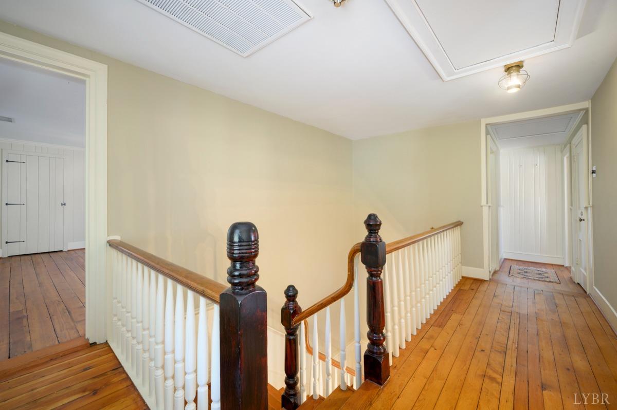 2812 Link Road Lynchburg, VA 24503 - Photo 27 of 65 a view of a hallway with wooden floor and stairs