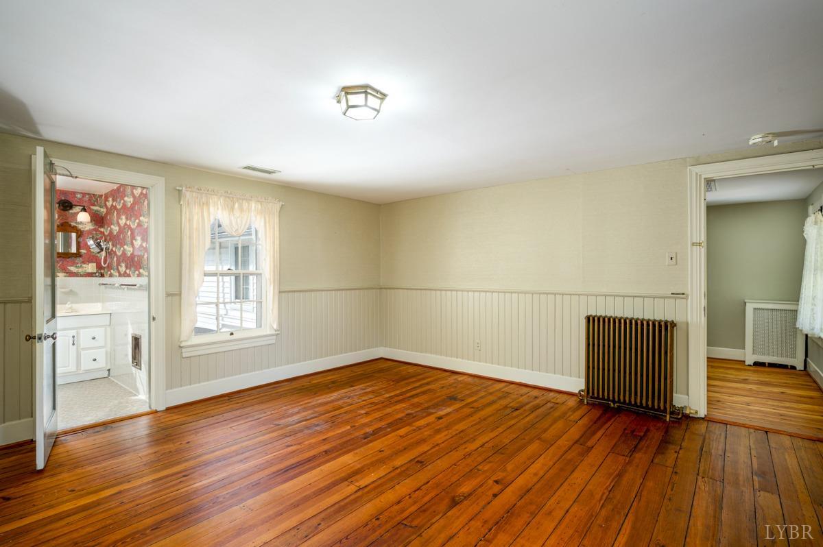 2812 Link Road Lynchburg, VA 24503 - Photo 28 of 65 an empty room with wooden floor and windows