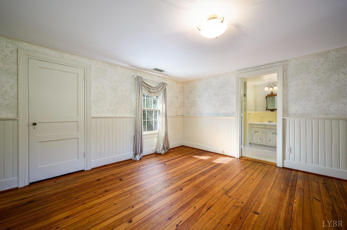 2812 Link Road Lynchburg, VA 24503 - Photo 30 of 65 an empty room with wooden floor and windows