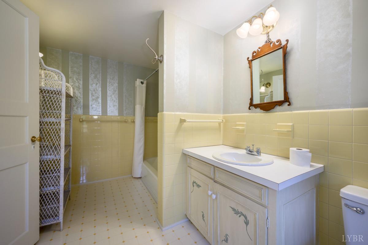 2812 Link Road Lynchburg, VA 24503 - Photo 31 of 65 a bathroom with a sink and a mirror