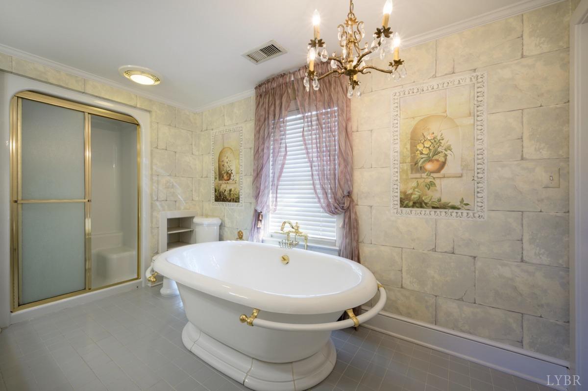 2812 Link Road Lynchburg, VA 24503 - Photo 35 of 65 a bathroom with a sink and mirror with bathtub