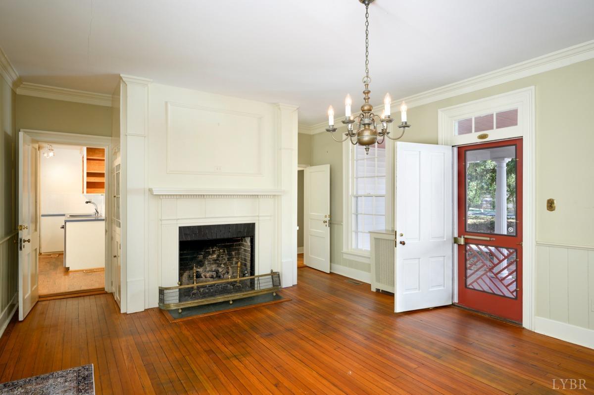 2812 Link Road Lynchburg, VA 24503 - Photo 7 of 65 a view of a livingroom with wooden floor a fireplace and window