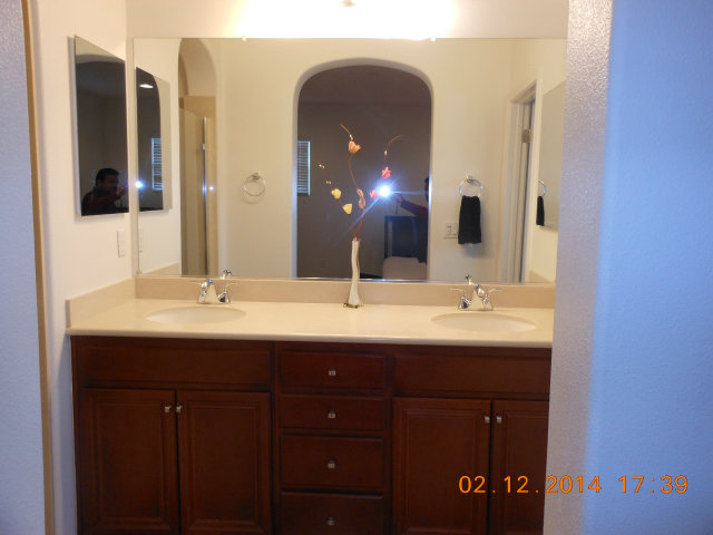 7542 Stoneleaf Road San Ramon, CA 94582 - Photo 16 of 24 a bathroom with a double vanity sink and a mirror