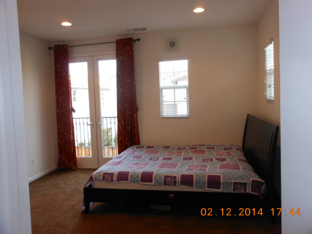 7542 Stoneleaf Road San Ramon, CA 94582 - Photo 19 of 24 a bedroom with a bed and a window