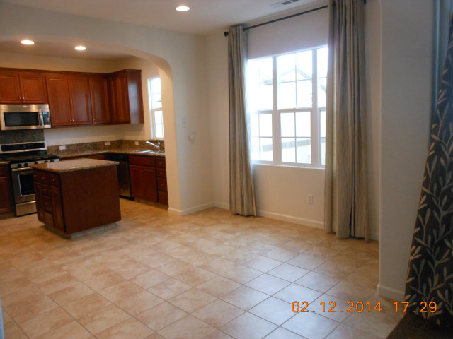 7542 Stoneleaf Road San Ramon, CA 94582 - Photo 4 of 24 a kitchen with stainless steel appliances granite countertop a stove a sink and a refrigerator