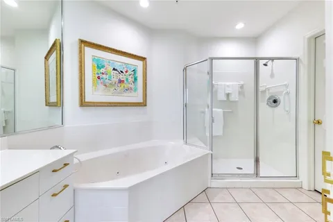 a bathroom with a bathtub and a shower