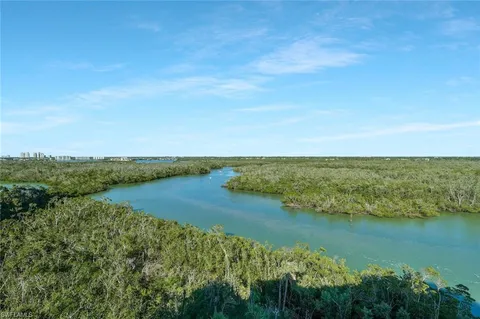 a view of an ocean and city