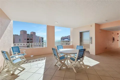 a view of a dining room with furniture and window
