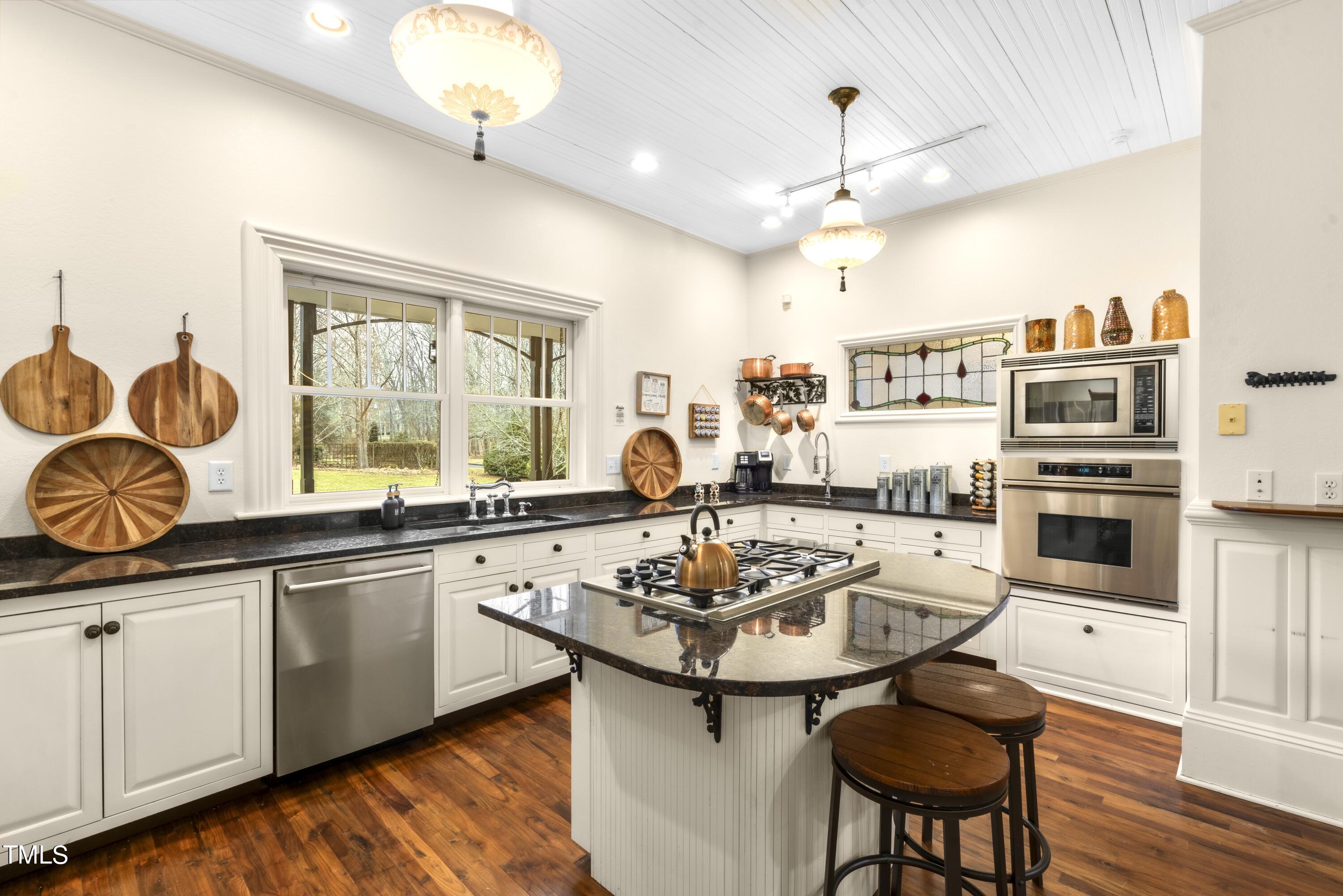 5612 Cabe Ford Road Durham, NC 27705 - Photo 10 of 42 a kitchen with a sink stove and cabinets