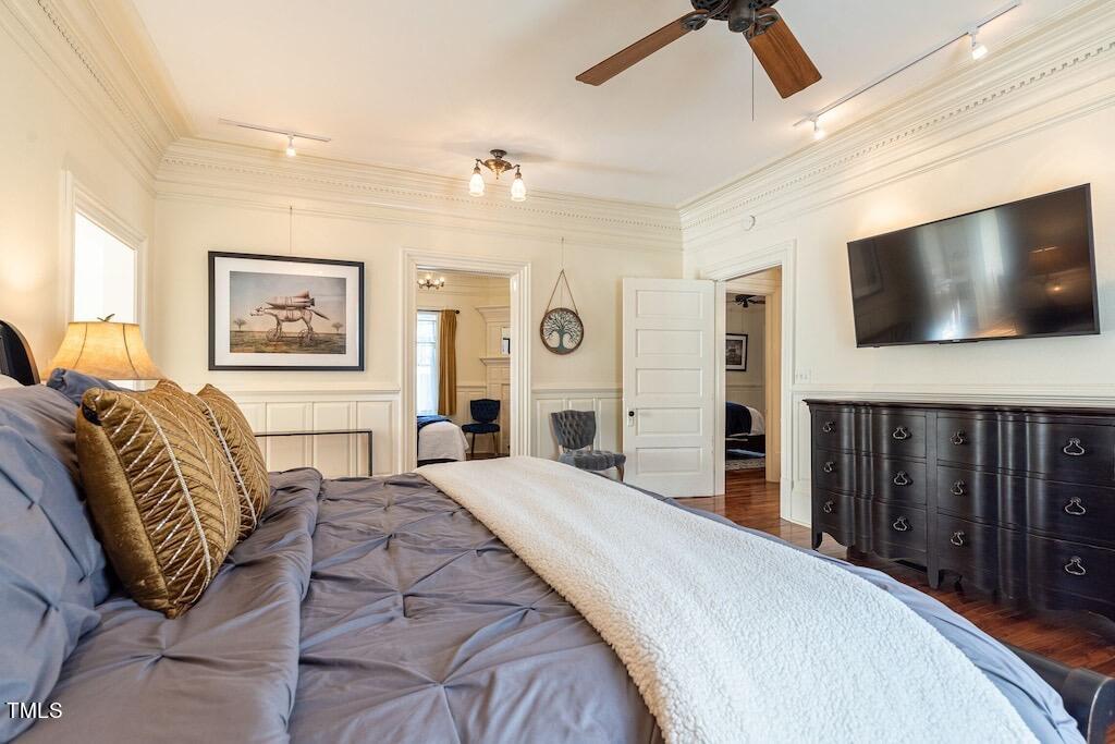 5612 Cabe Ford Road Durham, NC 27705 - Photo 14 of 42 a spacious bedroom with a large bed a flat screen tv and a window