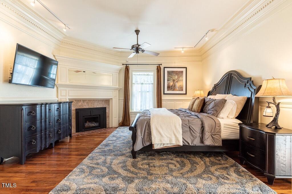 5612 Cabe Ford Road Durham, NC 27705 - Photo 15 of 42 a spacious bedroom with a bed and a flat screen tv