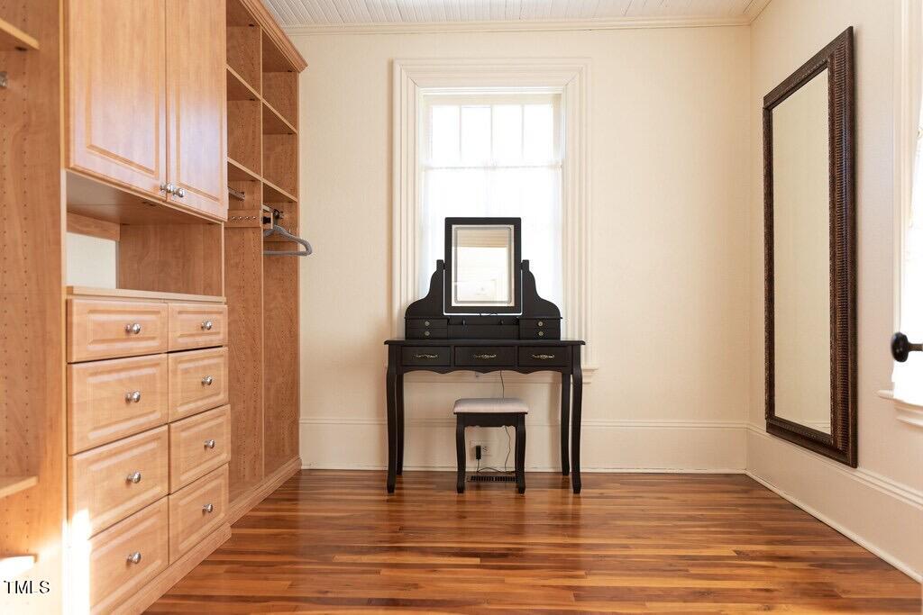 5612 Cabe Ford Road Durham, NC 27705 - Photo 20 of 42 a hallway with windows and a wooden floor
