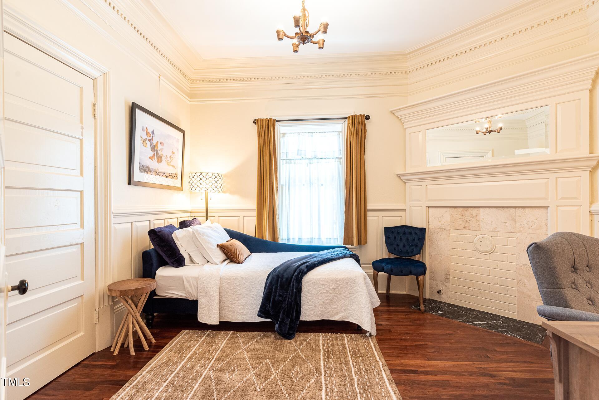 5612 Cabe Ford Road Durham, NC 27705 - Photo 22 of 42 a bedroom with a bed and wooden floor