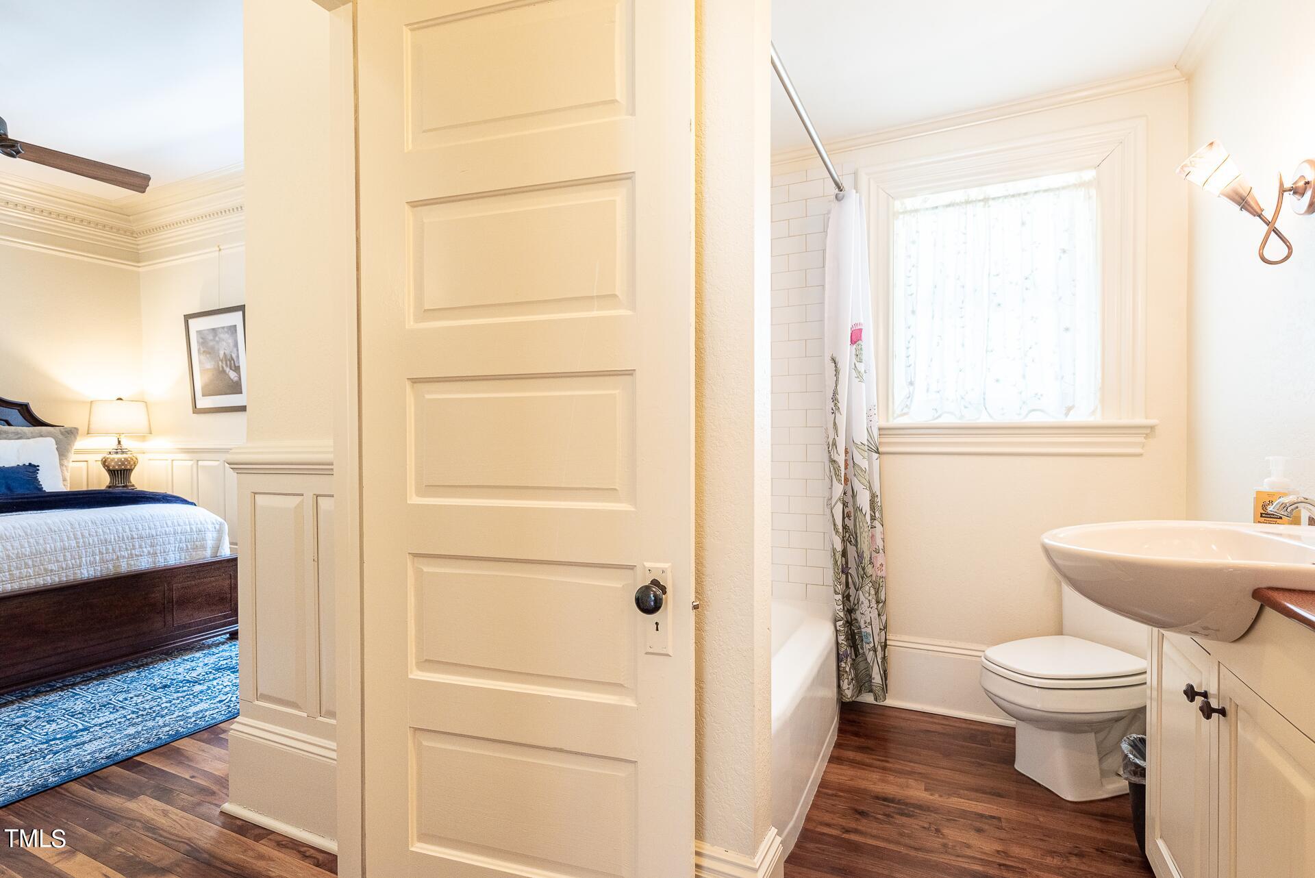 5612 Cabe Ford Road Durham, NC 27705 - Photo 23 of 42 a white toilet sitting next to a bathroom sink