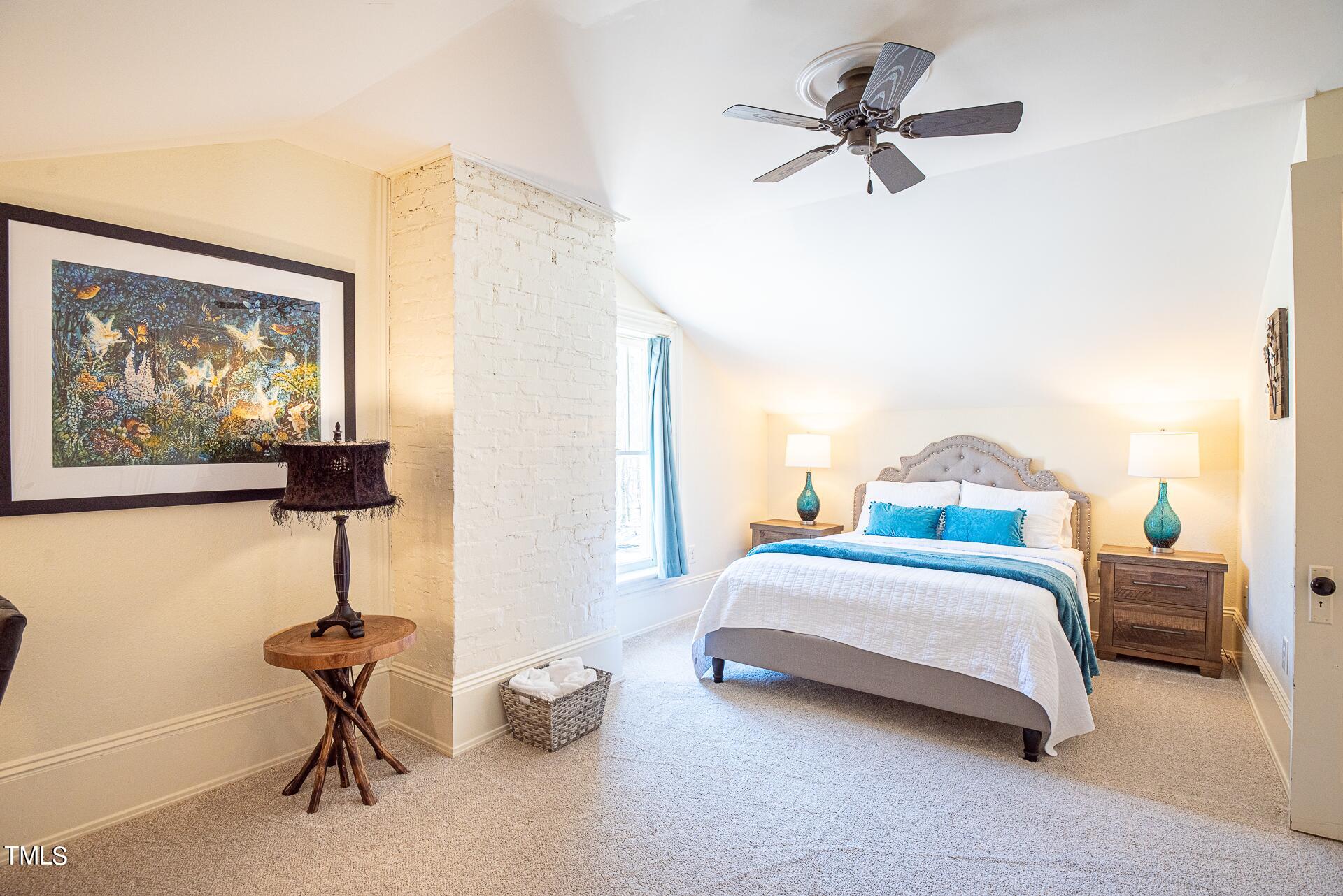 5612 Cabe Ford Road Durham, NC 27705 - Photo 28 of 42 a bedroom with bed and a painting on the wall