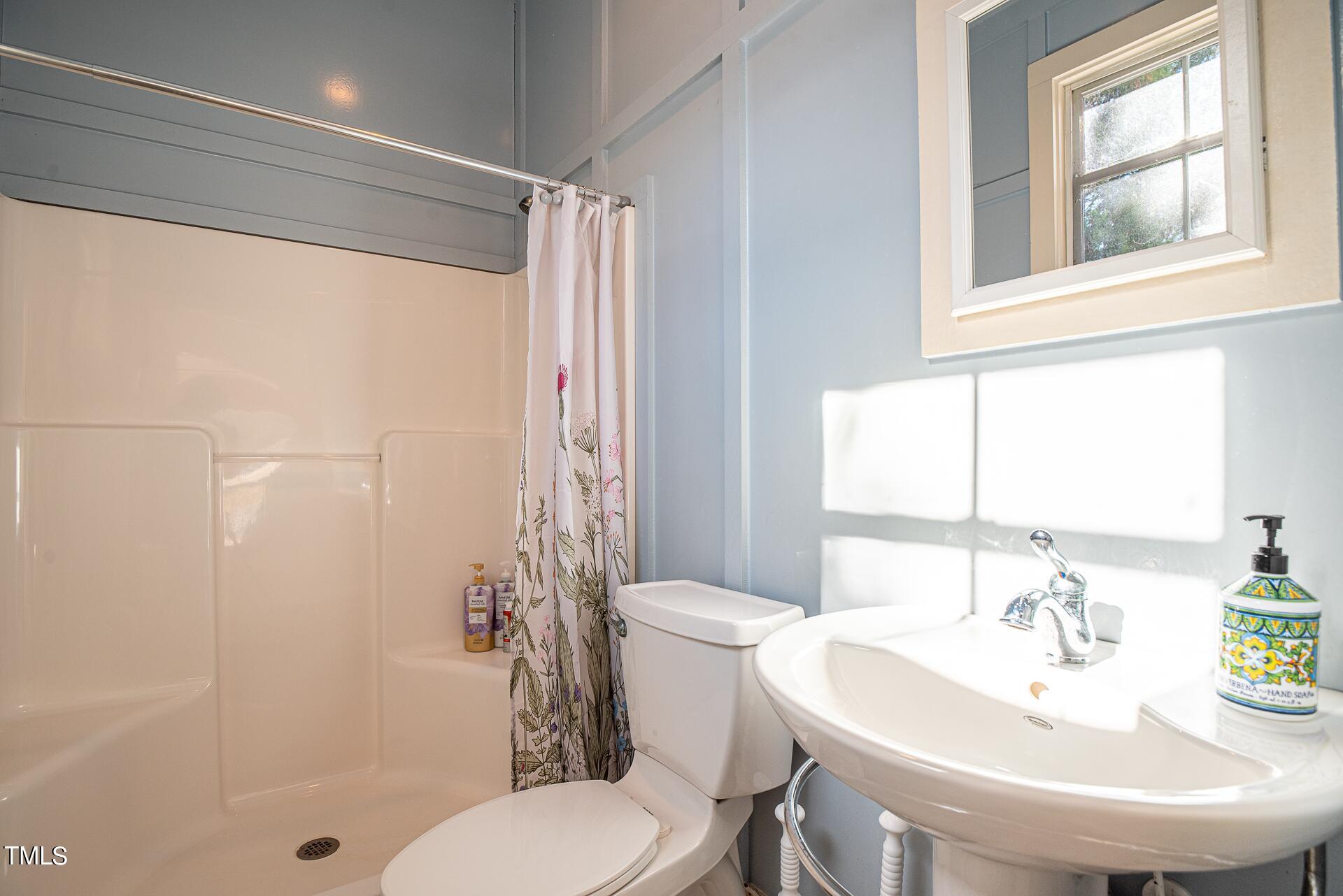 5612 Cabe Ford Road Durham, NC 27705 - Photo 36 of 42 a bathroom with a sink toilet and shower