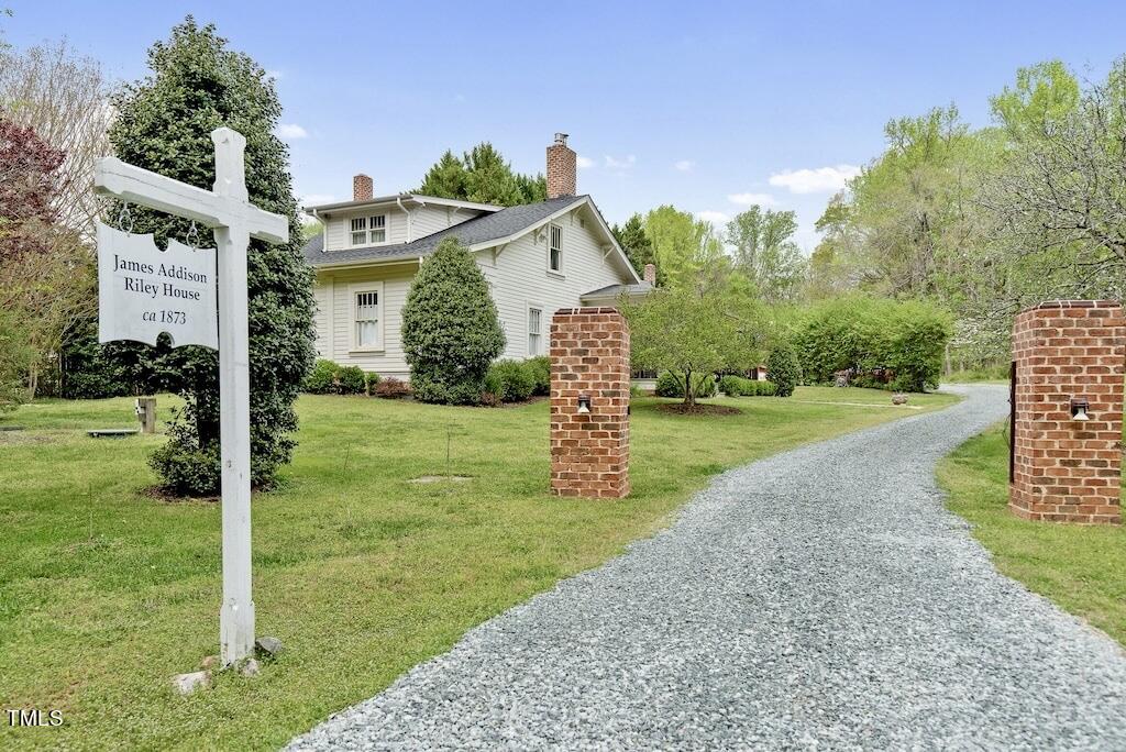 5612 Cabe Ford Road Durham, NC 27705 - Photo 4 of 42 a front view of a house with yard and green space