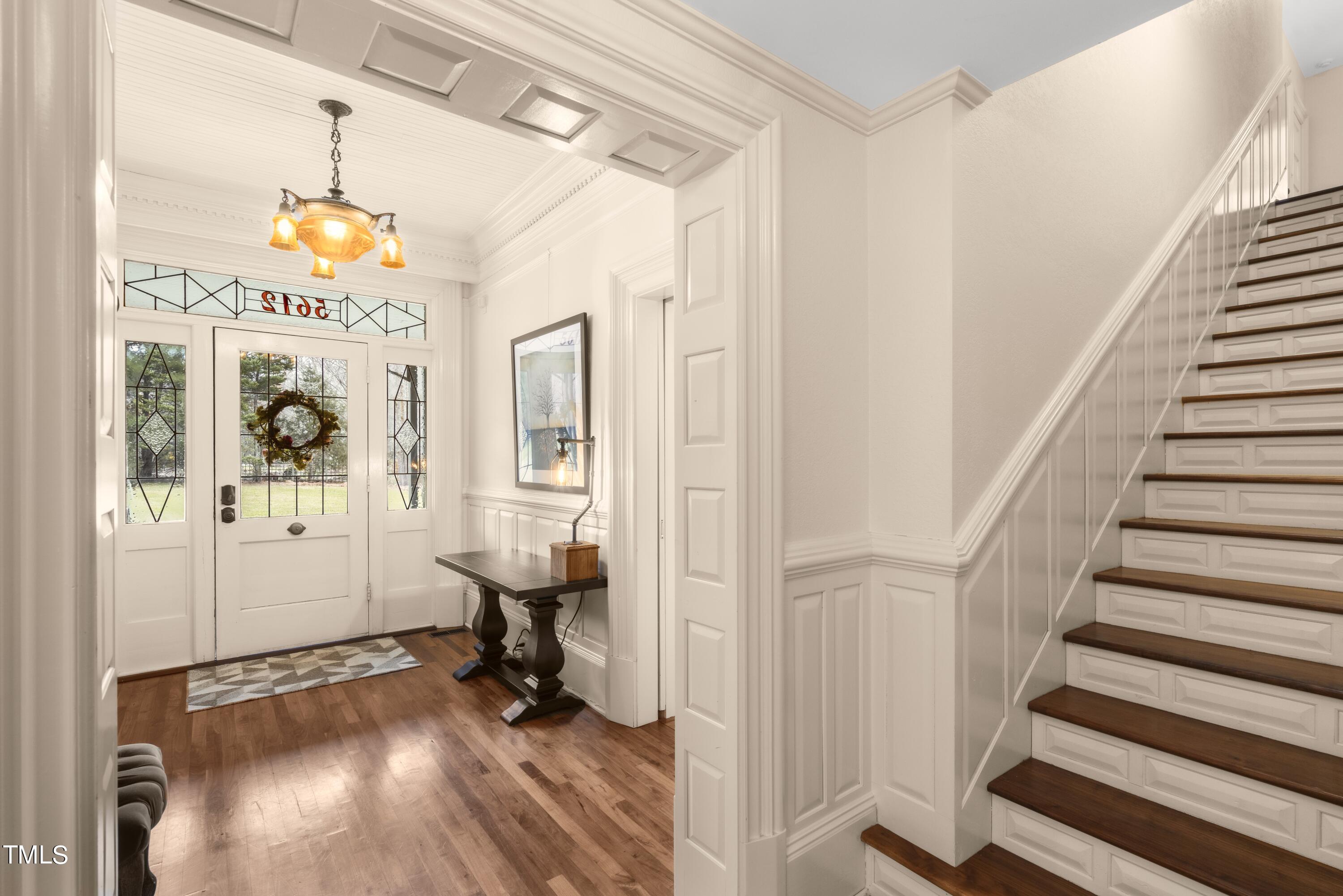 5612 Cabe Ford Road Durham, NC 27705 - Photo 8 of 42 a view of an entryway with wooden floor and windows
