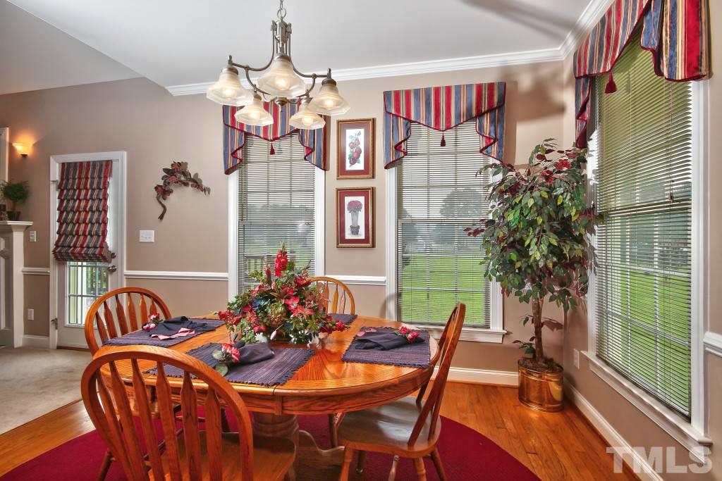 1012 Pasture View Lane Raleigh, NC 27603 - Photo 8 of 25 a view of a dining room with furniture and chandelier