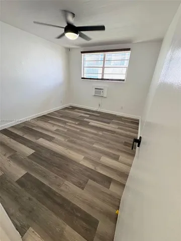 a view of a room with air conditioner and windows