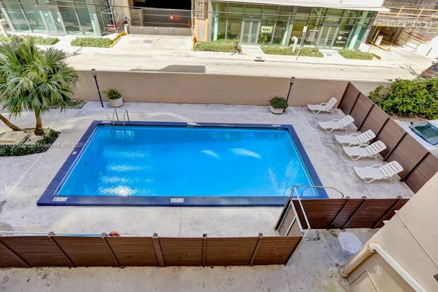 a house view with a seating space and potted plants