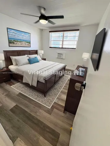 a bedroom with furniture and a window