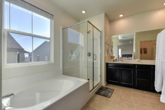 a bathroom with a bathtub and a sink
