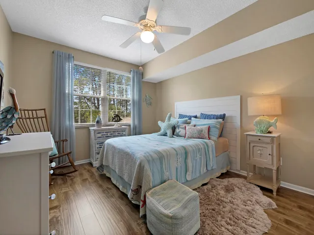 a bedroom with a bed and a table