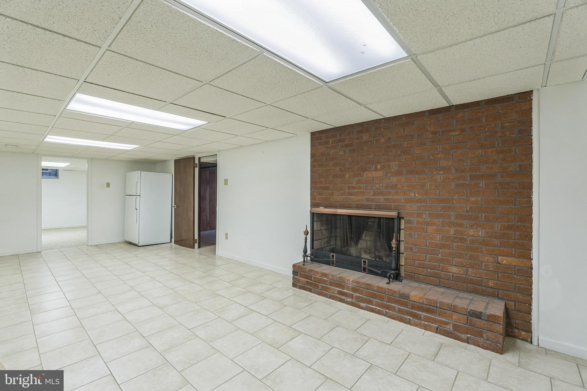 113 Kingston Road Cheltenham, PA 19012 - Photo 25 of 30 Finished Basement Wood Burning Fireplace