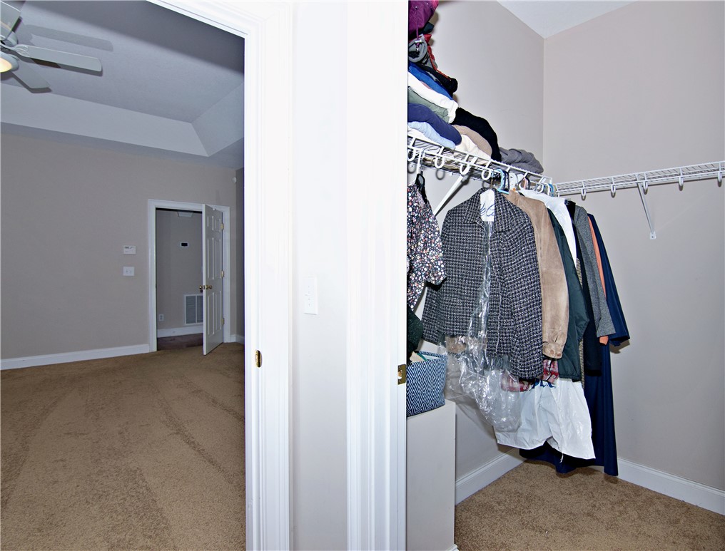 7893 Athens Road Carnesville, GA 30521 - Photo 21 of 50 This spacious primary bedroom features convenient closet storage and ample natural light.
