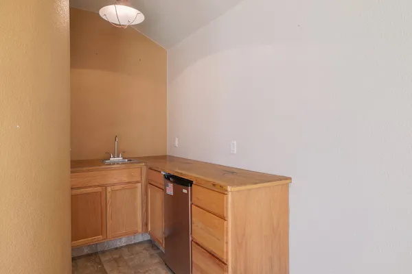 a utility room with sink dryer and washer