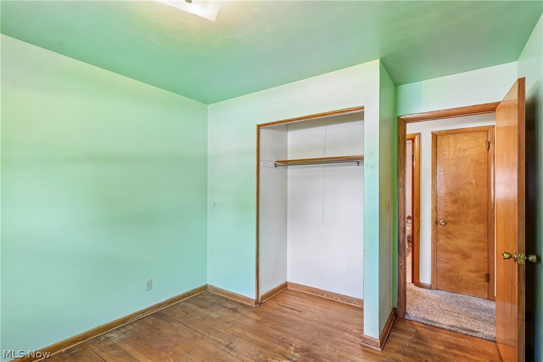 2758 Shellhart Road Norton, OH 44203 - Photo 21 of 41 Bedroom with wood flooring