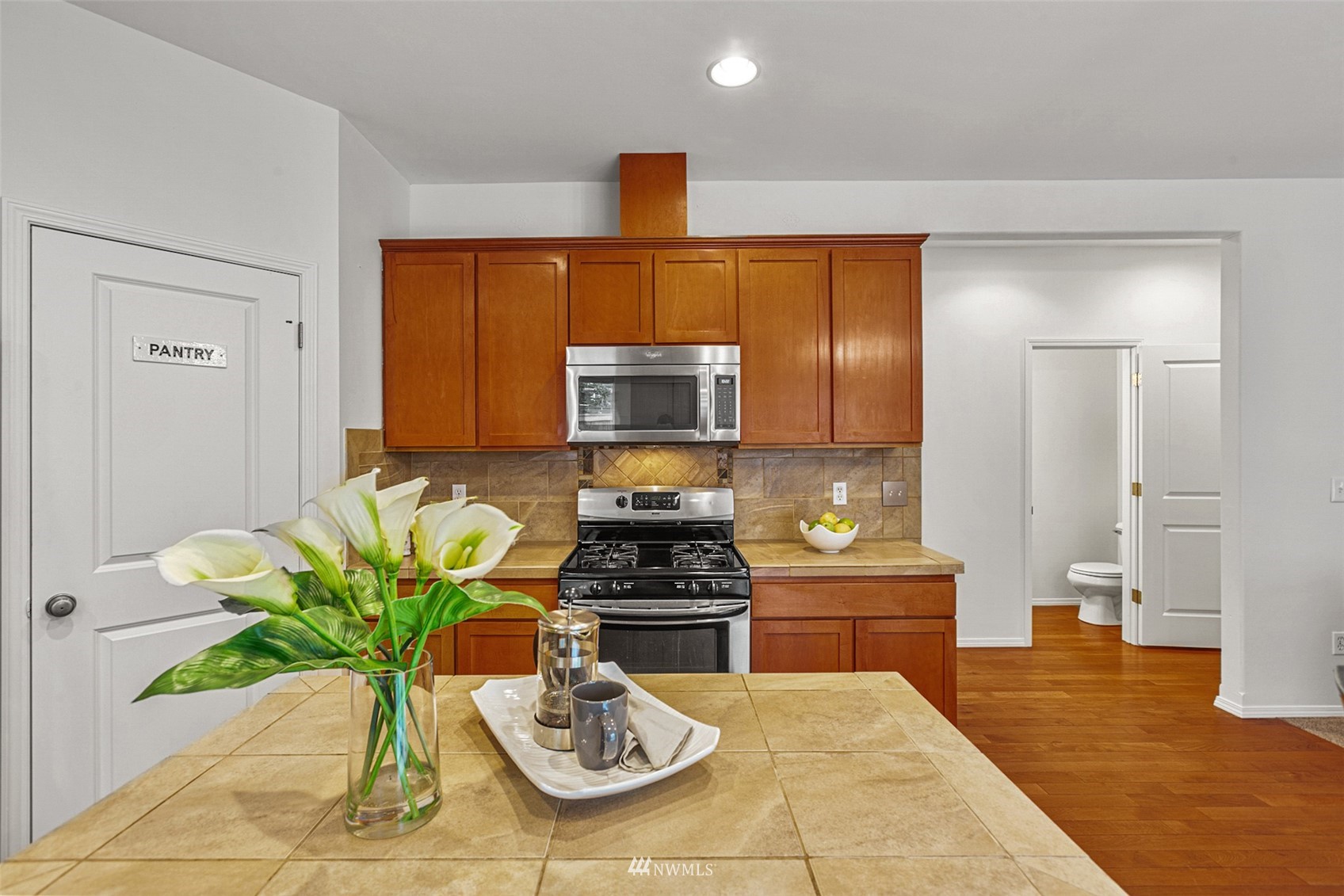 23904 17th Avenue West Bothell, WA 98021 - Photo 12 of 34 a kitchen with granite countertop a sink stainless steel appliances and cabinets
