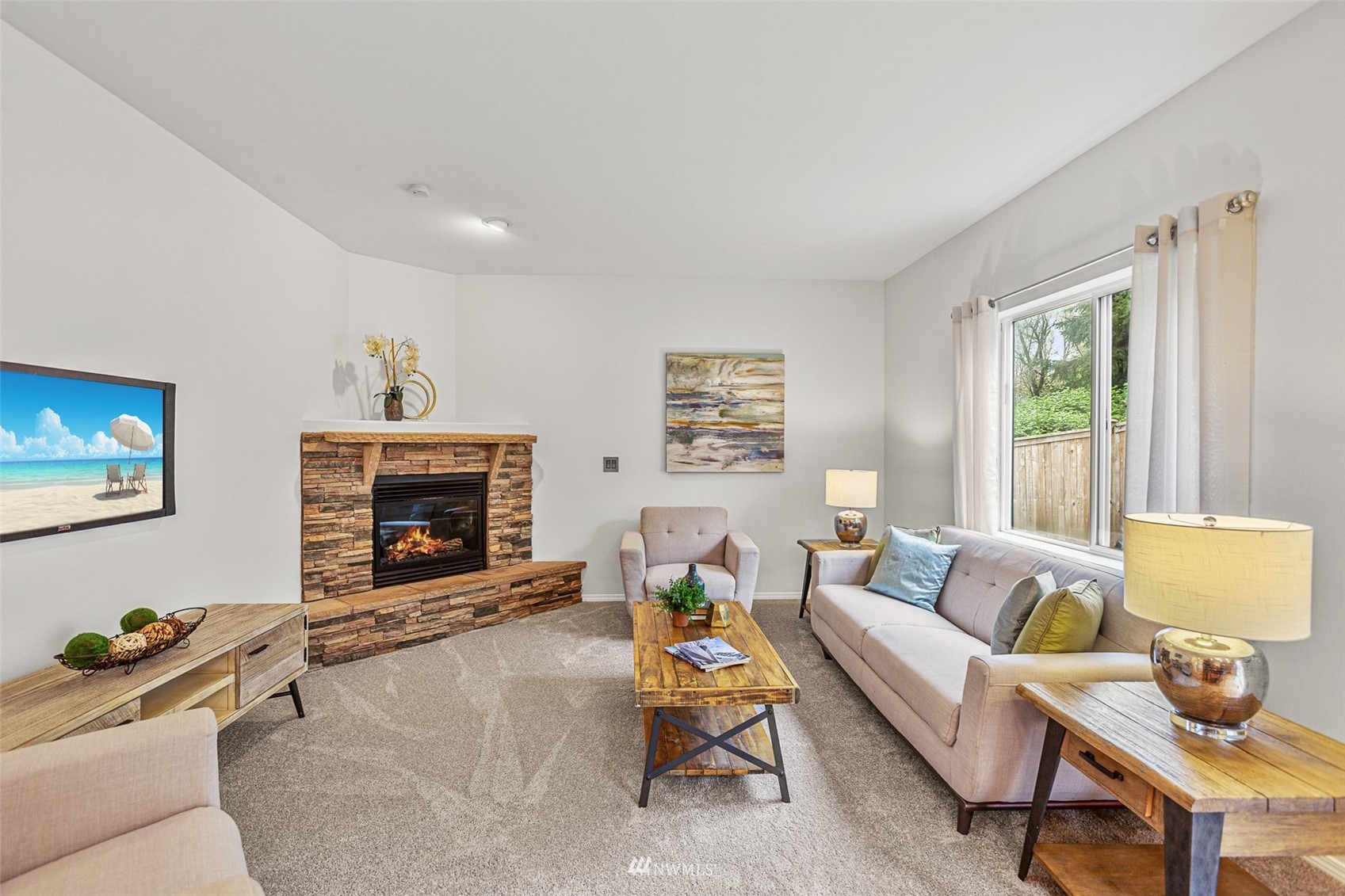 23904 17th Avenue West Bothell, WA 98021 - Photo 15 of 34 a living room with furniture and a fireplace