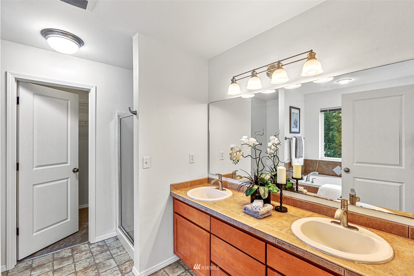 23904 17th Avenue West Bothell, WA 98021 - Photo 23 of 34 a bathroom with a sink and a mirror