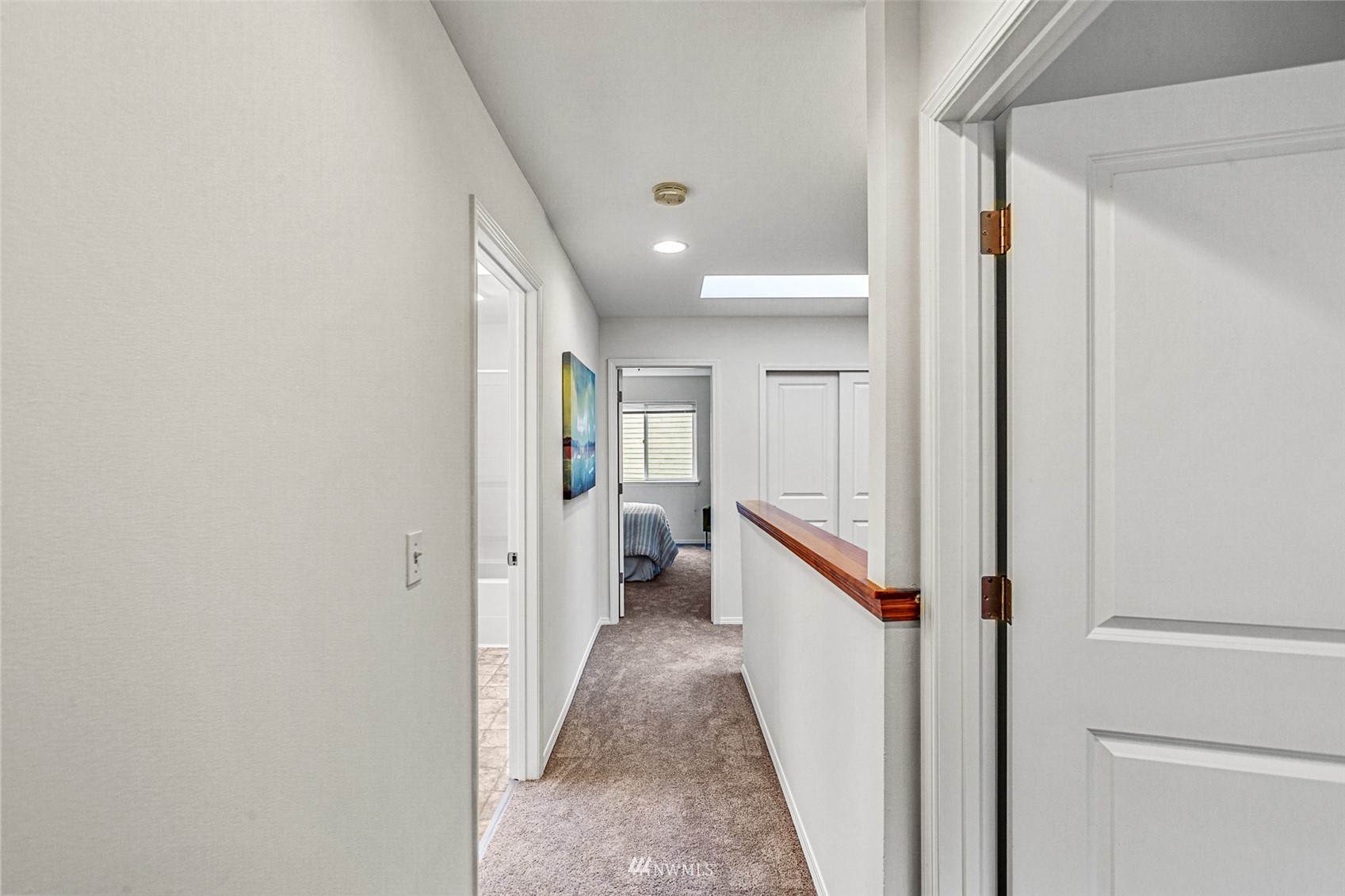 23904 17th Avenue West Bothell, WA 98021 - Photo 25 of 34 a view of a hallway with white walls and stairs