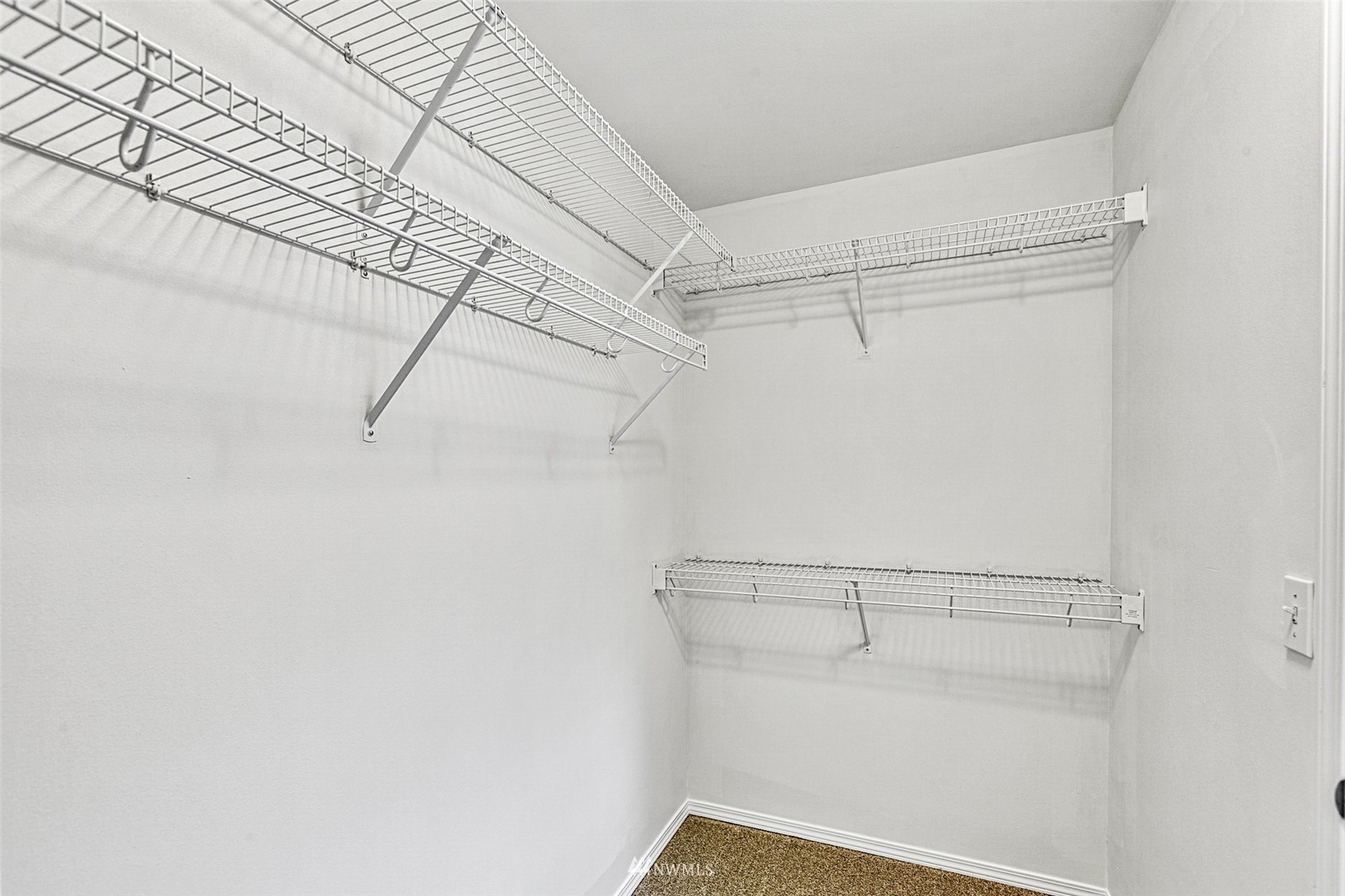 23904 17th Avenue West Bothell, WA 98021 - Photo 27 of 34 a view of a room with racks on the wall