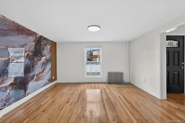 a kitchen with stainless steel appliances granite countertop a stove a refrigerator and a microwave