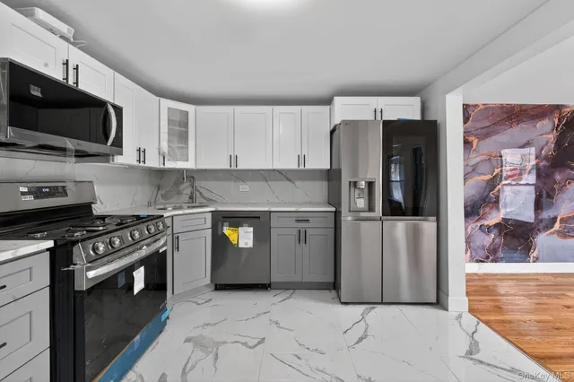 a bedroom with a bed and a night stand