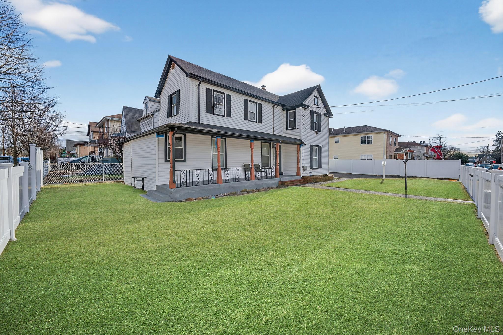 136-03 220th Street Queens, NY 11413 - Photo 20 of 27 a house view with a garden space