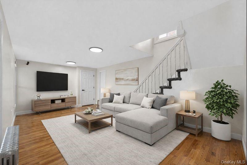 136-03 220th Street Queens, NY 11413 - Photo 2 of 27 a living room with furniture and a flat screen tv