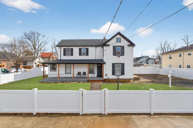 a kitchen with granite countertop a refrigerator and a stove top oven