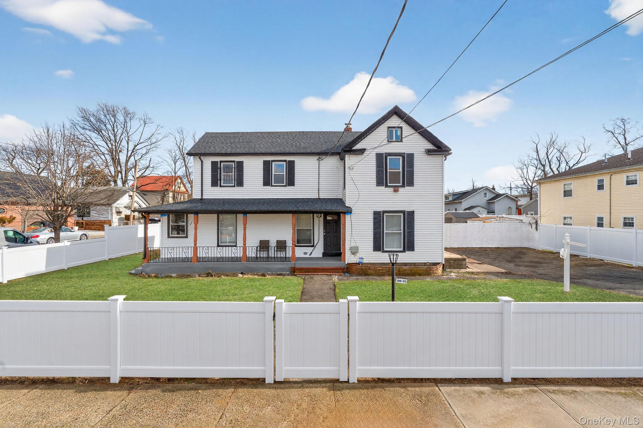 136-03 220th Street Queens, NY 11413 - Photo 25 of 27 a house that has a lots of windows in it