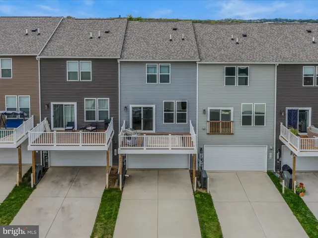 a view of a brick house with large windows