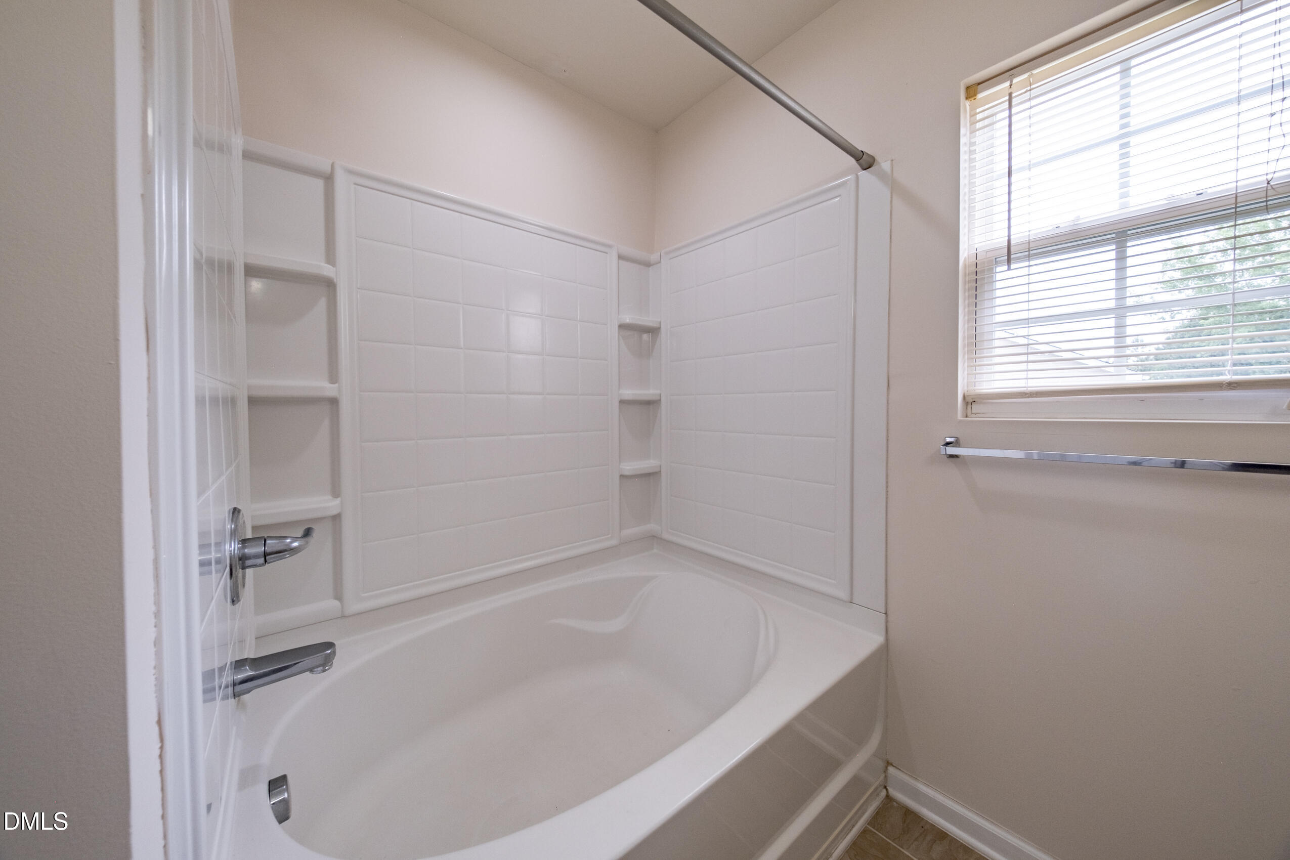 719 Obsidian Way Durham, NC 27703 - Photo 36 of 41 a bathroom with a tub and shower