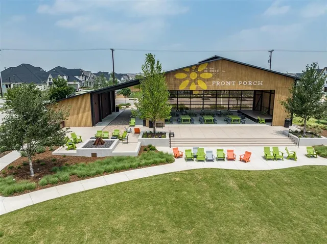 a view of a swimming pool with an outdoor seating